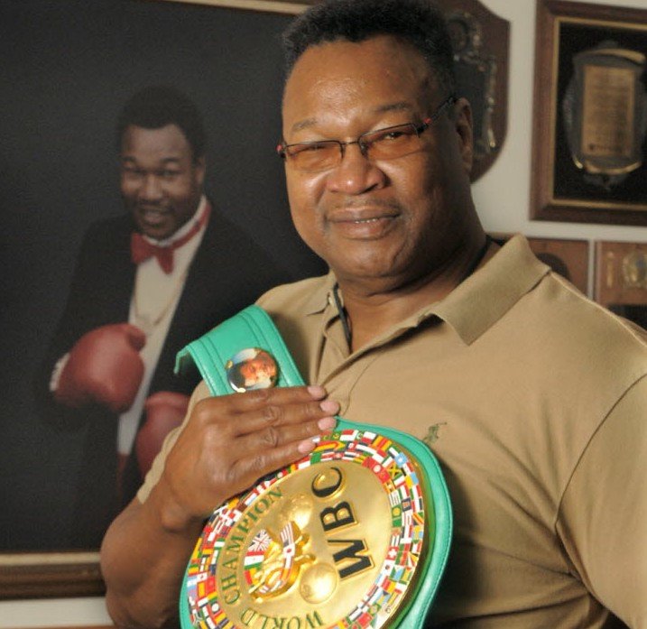 larry-holmes-with-championship-belt